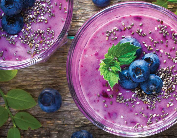 Smoothie bowls with chia seeds and blueberries, showcasing plant-based dairy innovation